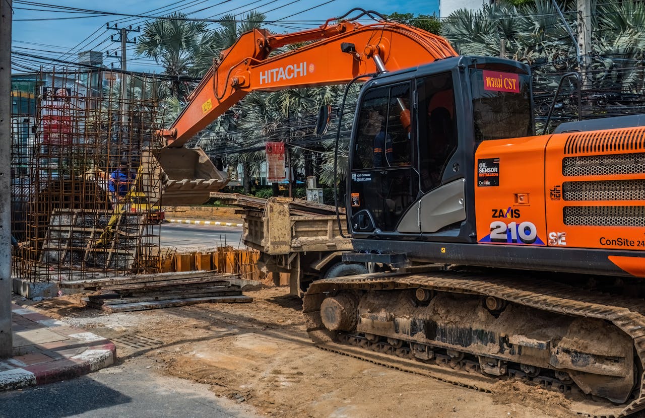 Home Construction site with heavy machinery and workers in Pattaya, Thailand.